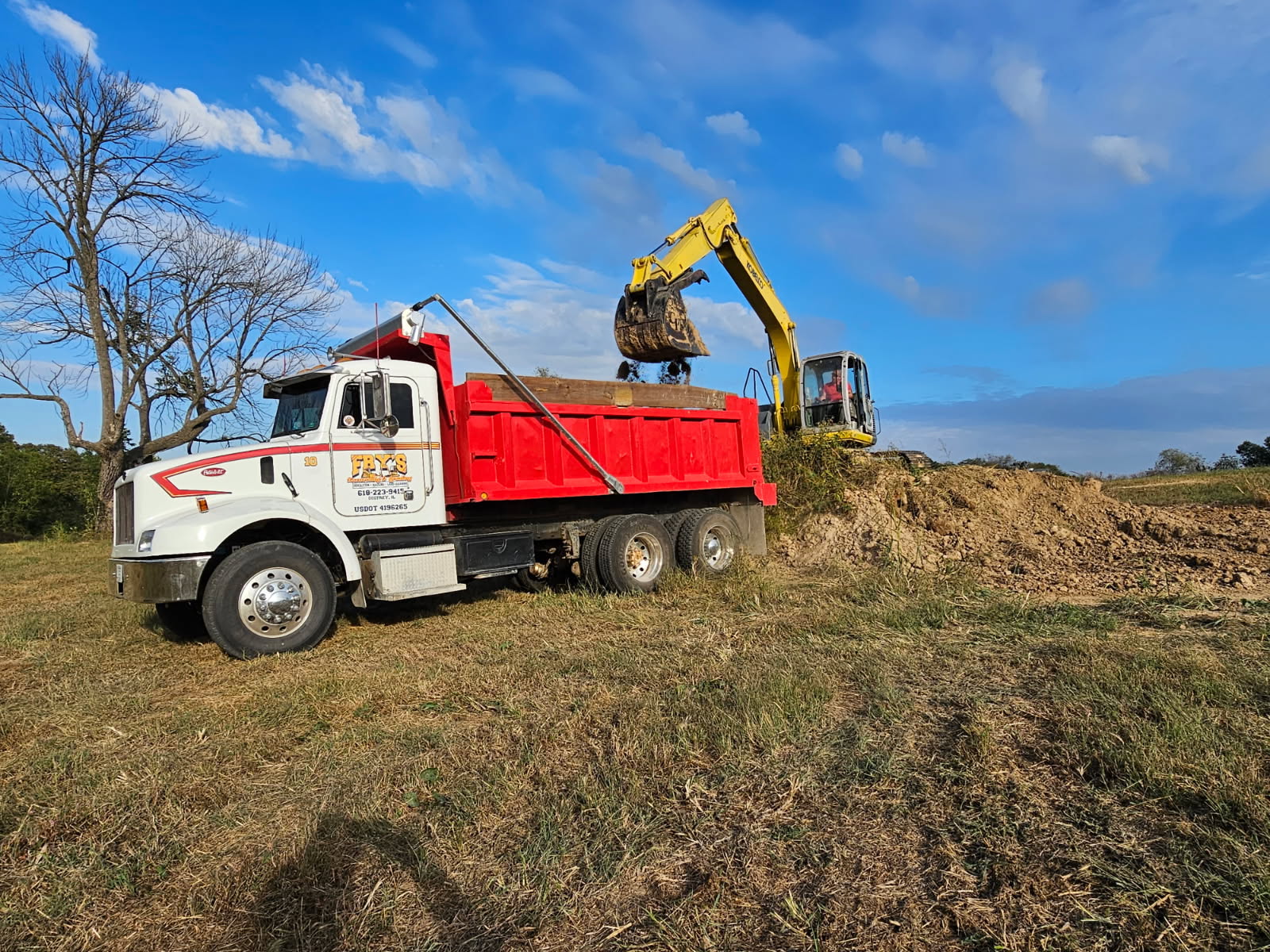 Fry's Excavating backhoe loader for excavation and hauling