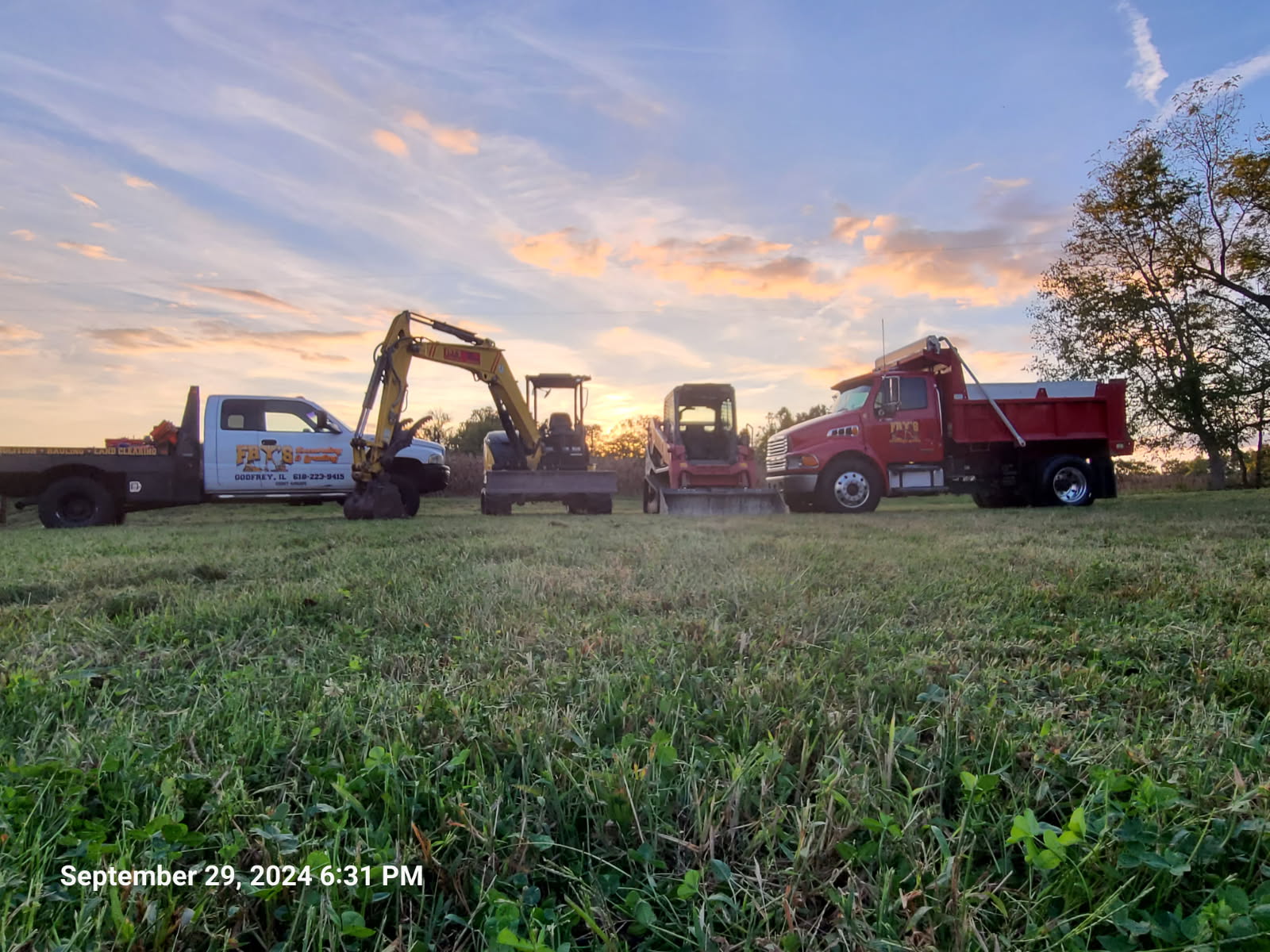 Fry's Excavating skid steer loader for grading and site preparation